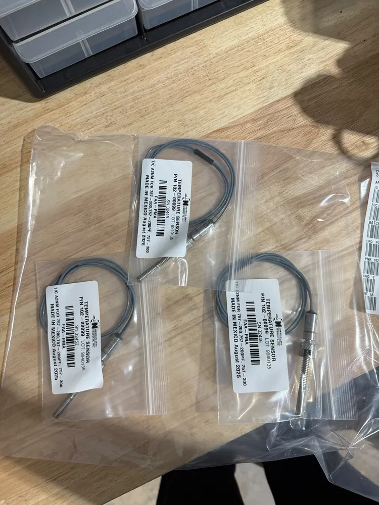 Aircraft parts in sealed bags, each with its own label showing part number, serial number and lot